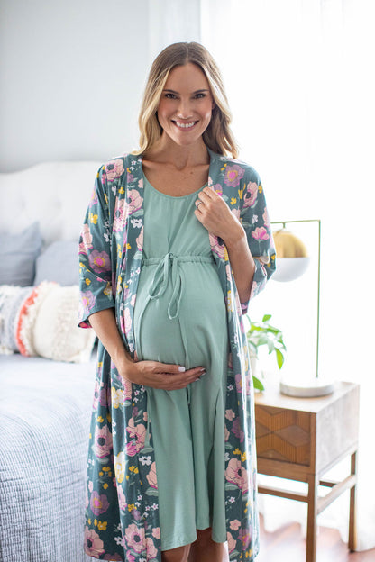 Maternity robe for mom-to-be with pink and yellow flowers against a deep green background. The Charlotte print is perfect for bold, feminine moms. Coordinated with a Sage labor gown underneath. 